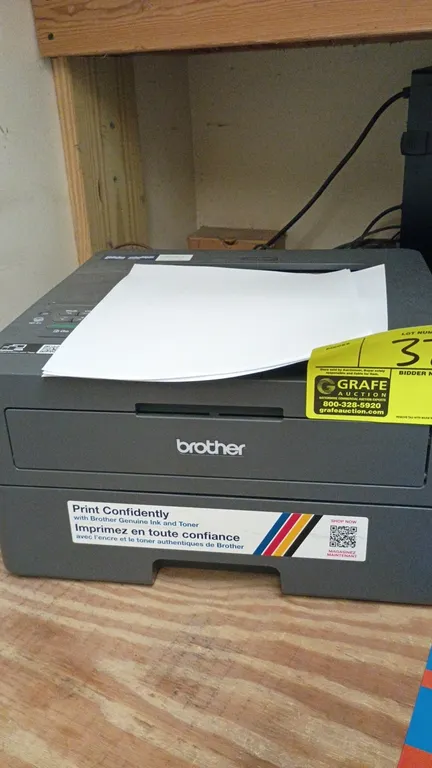 Brother compact laser printer. Uses Brother TN830 series toner cartridges. Features front-loading paper tray and top control panel.