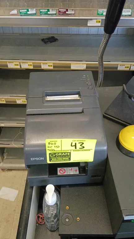 NCR point-of-sale checkout systems. Setup includes NCR POS computer terminals, Acer monitors, NCR displays, Epson receipt printers, NCR bi-optic scann
