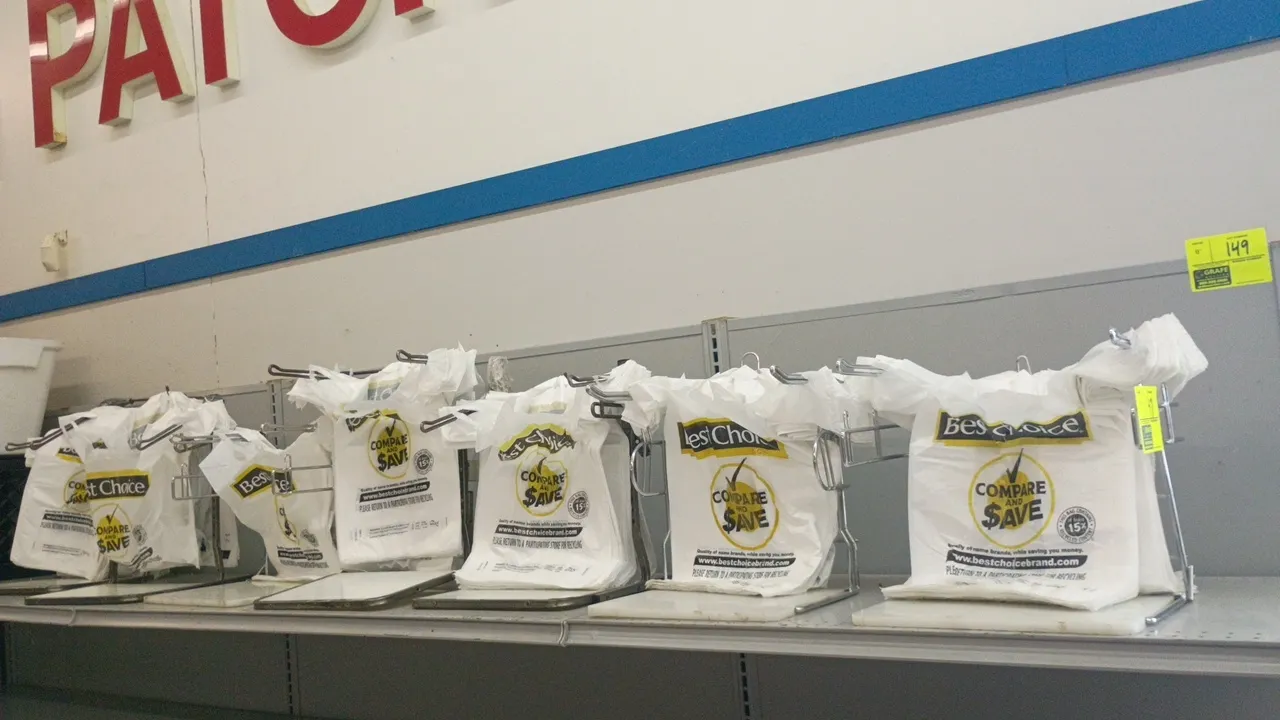 T-shirt bag holders. Features wire metal rack construction with dual hanging arms, central hook tab, and solid base plates. Designed for countertop re