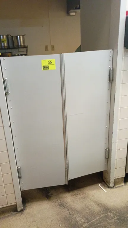 Double swing traffic doors. Features heavy-duty double-action hinges and riveted edging. Dimensions: 17.5"W x 48"H per panel.