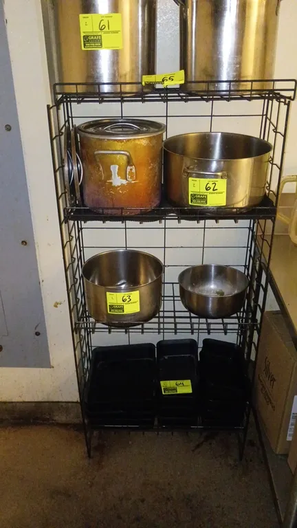 4-tier wire shelving rack. Features black wire construction with integrated side and back wire grid panels. Contents not included.