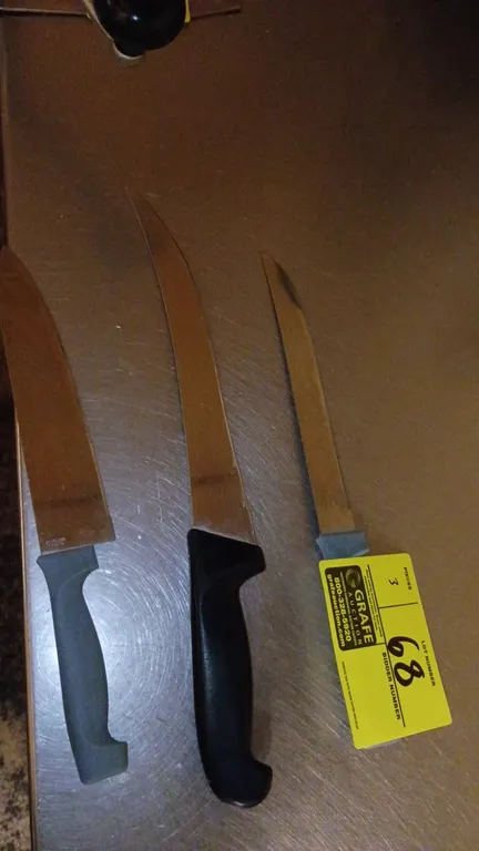 Assorted kitchen knives. Features stainless steel blades and molded plastic handles in assorted styles including chef, curved breaking, and slicing bl