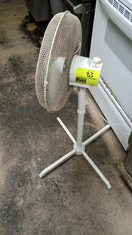 Cool Master pedestal oscillating fan. Features wire mesh safety guard, oscillating head, and adjustable height stand. Mounted on a 4-leg cross base.