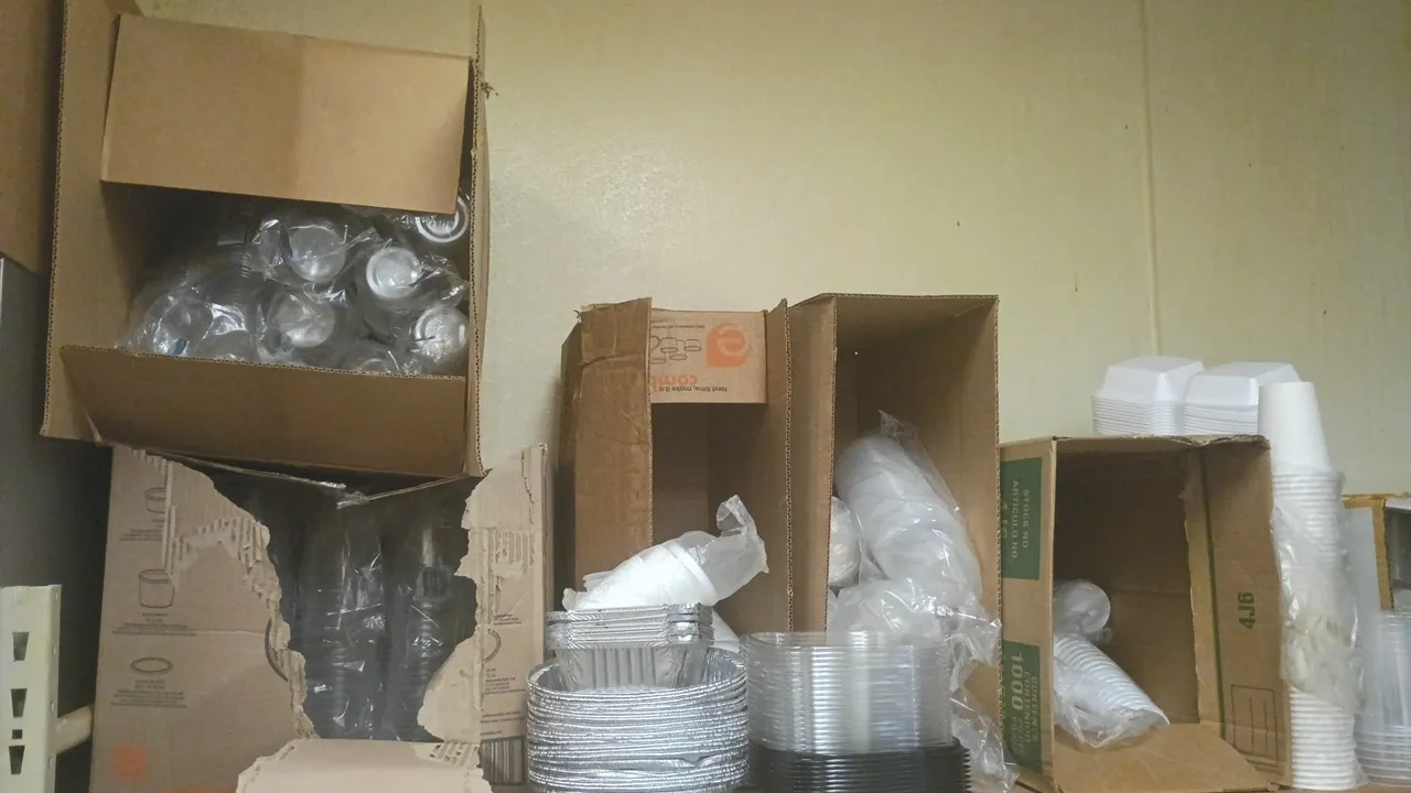 Assorted food service packaging and disposables. Includes plastic and foam cups, deli food storage containers with lids, chicken containers, hoagie bo