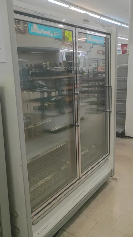 Kysor//Warren QLV5V14-02UN reach-in display freezers. Features double glass doors, adjustable shelving, pegboard interior, LED lighting, and electric