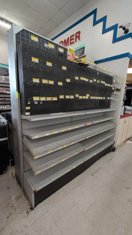 14'L of Madix gondola shelving. Features gray finish, 72"H uprights, 14"/14" base shelves, upper metal shelves, and pegboard backing. Base boards on 1