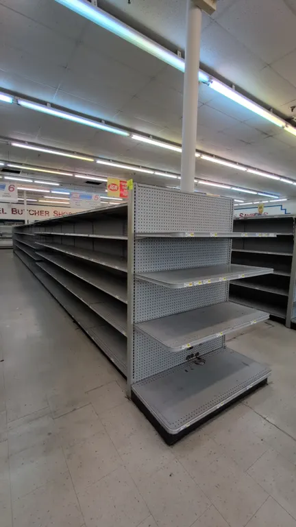 112'L of Madix gondola shelving. Features gray finish, 72"H uprights, 22"/22" base shelves, adjustable upper shelves, and pegboard and solid backing p