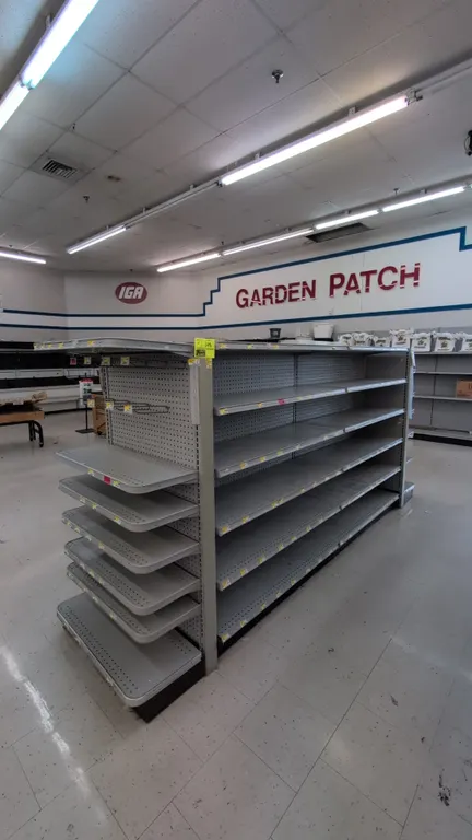 22'L of Madix gondola shelving. 60"H uprights with 16"/16" base shelves. Features gray finish, pegboard backing, and multi-tier adjustable shelves. No