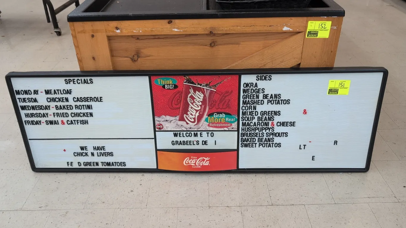 Coca-Cola menu display board. Features grooved letter board sections, center Coca-Cola graphics, black frame, and assorted changeable letters as shown