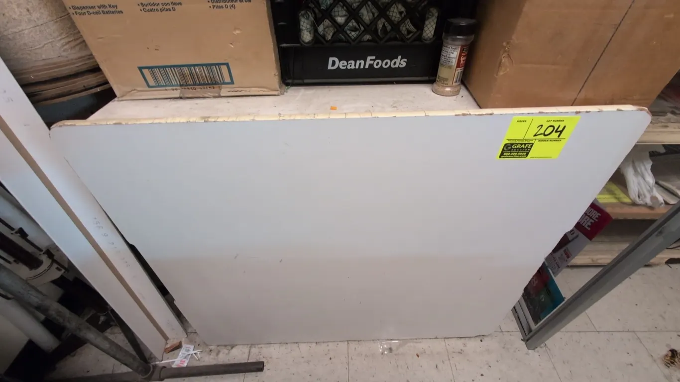 Laminate countertop. Features a white laminate finish with rounded front corners. 36"L. Background items not included.