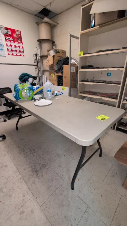 Samsonite poly folding table. Features a molded polyethylene top and folding tubular metal base. Dimensions: 72" x 30". Contents not included.