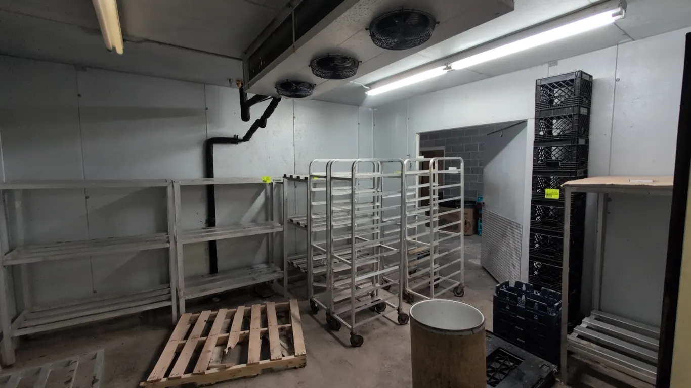 Tonka 2-room walk-in cooler and meat room. Includes (2) 3-fan evaporator coils, (4) poly swing doors, (1) metal swing door, (3) sprinkler heads, and f