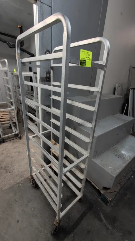 Aluminum meat lug rack. Features aluminum angle runner slides. Dimensions: 15" x 69"H. Mounted on casters.