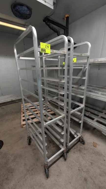 Aluminum meat lug racks. Features welded aluminum construction with angle runner slides for lugs or trays. 15" x 69"H. Mounted on swivel casters.