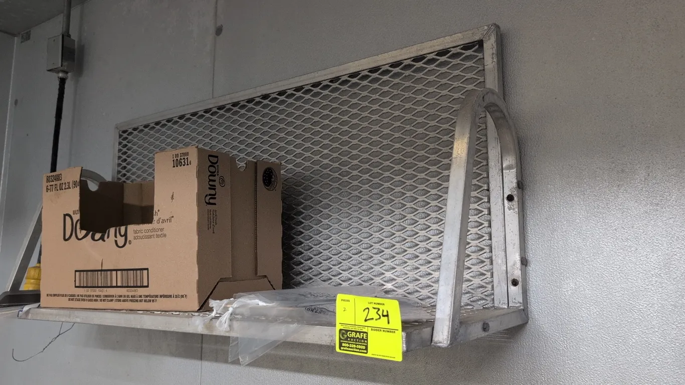 Aluminum wall-mounted shelves. Features expanded metal mesh shelf and back panel with curved tubular side supports. 31"L. Wall-mount design. Contents