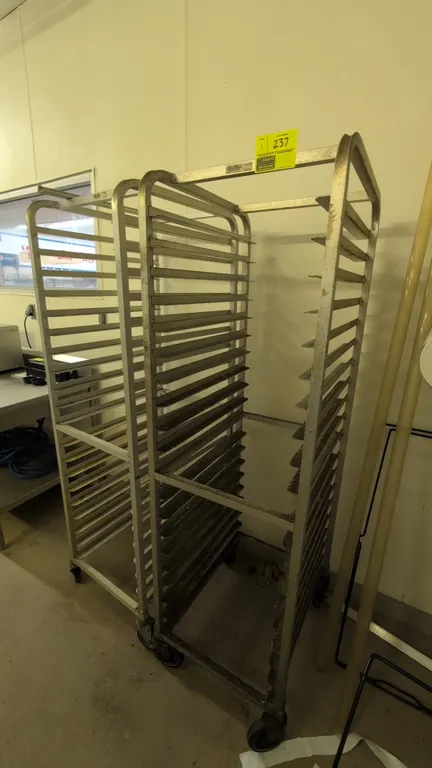 Kelmax aluminum channel pan racks. Features multi-tier channel slides and welded aluminum frame construction. 71"H. Mounted on swivel casters.