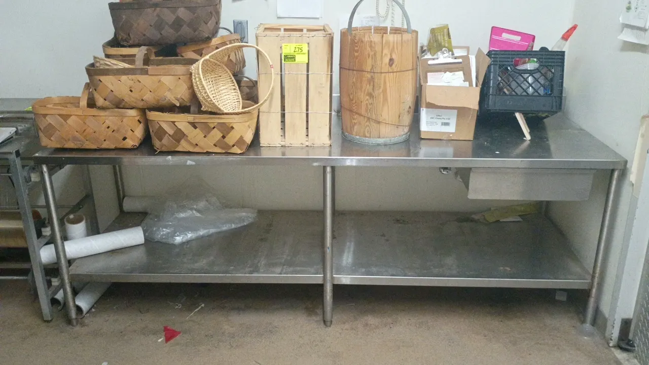Stainless steel prep table. Features a flat work top, stainless steel undershelf, and a single undercounter drawer. Mounted on 6 tubular legs with adj