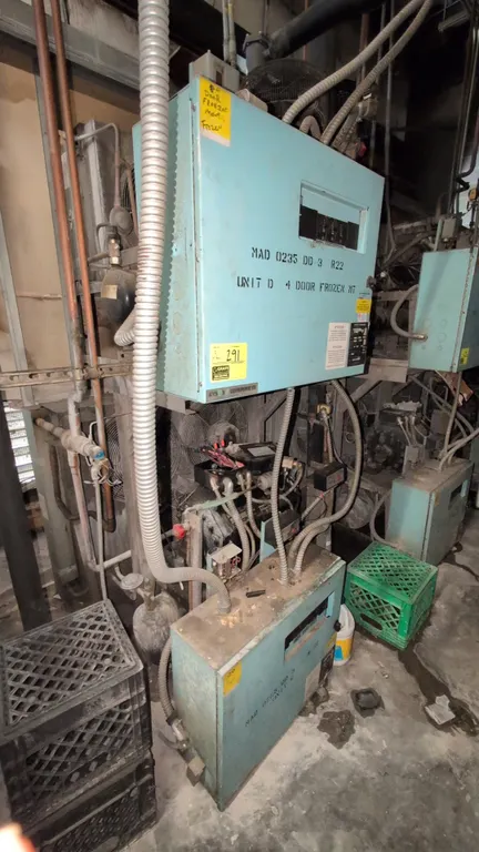 Kysor Warren refrigeration compressor racks. Includes MAD-0765-DD-3 low-temp rack and MAD-0235-DD-3 medium-temp rack. Features (2) Copeland compressor
