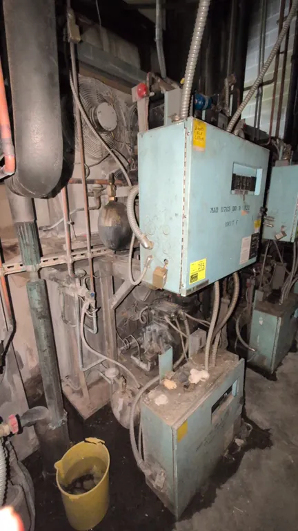 Kysor Warren commercial refrigeration compressor racks. Includes (1) MAD-745-DH-3 medium-temp rack and (1) MAD-0765-DD-3 low-temp rack. Features (2) 7
