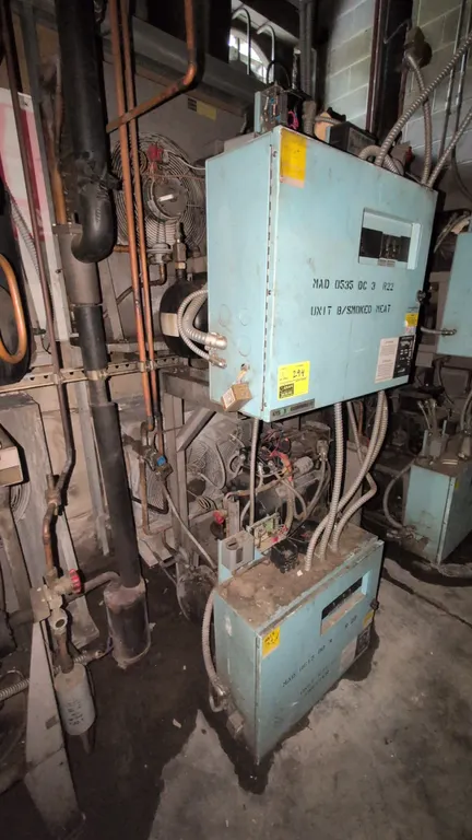 Kysor Warren refrigeration compressor racks. Includes MAD-615-DD-3 low-temp unit (S/N: 030764122) with 6 HP Copeland compressor and MAD-0535-DC-3 medi