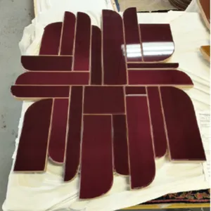 Holly Hunt Elements No. 159 Eclipse Collection wall sculpture. Features a geometric segmented design with high-gloss burgundy finish mounted on wood b