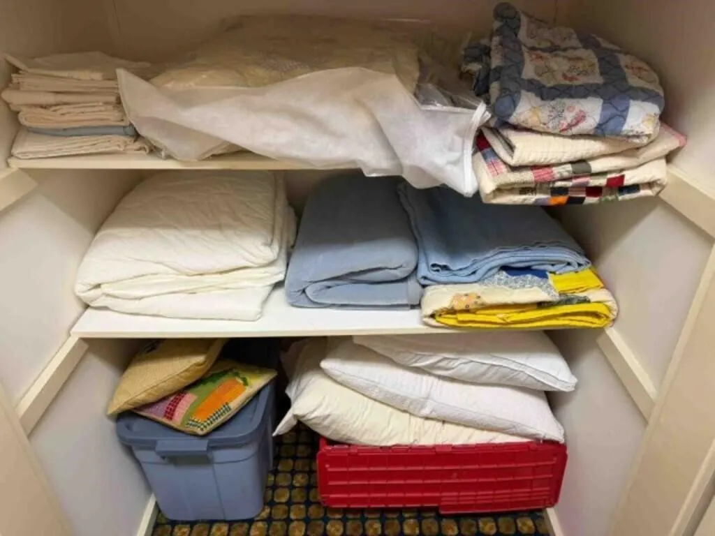 closet of comforters, pillows, linen, Quilts,