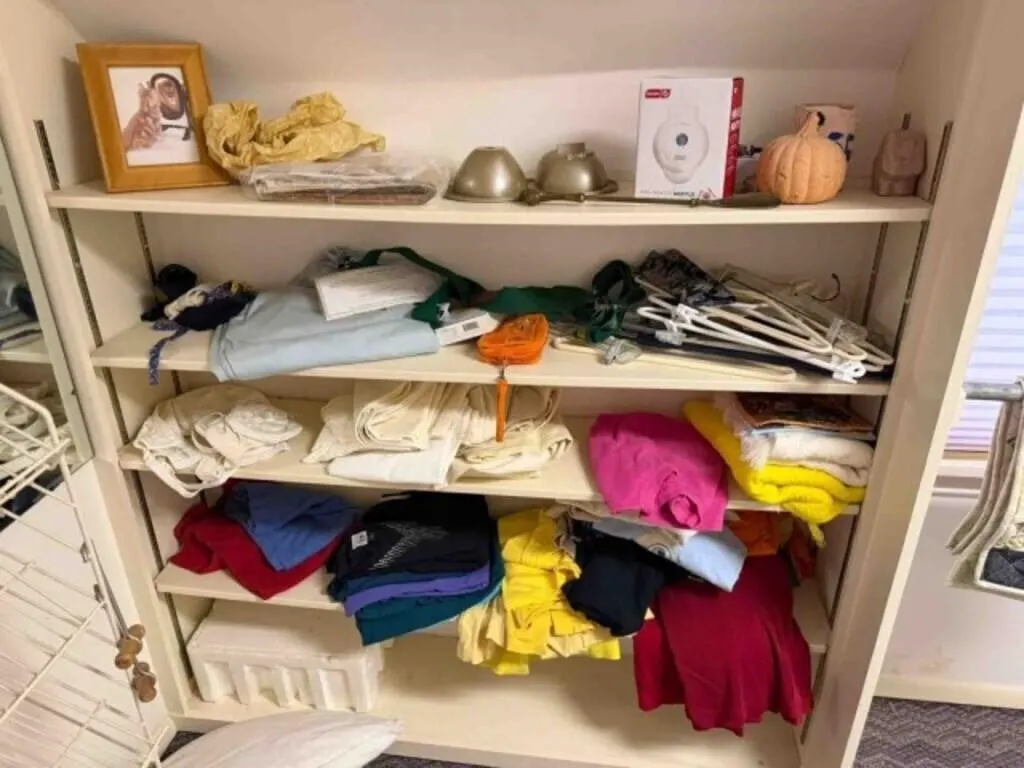 Contents of closet upstairs, ladies hats,