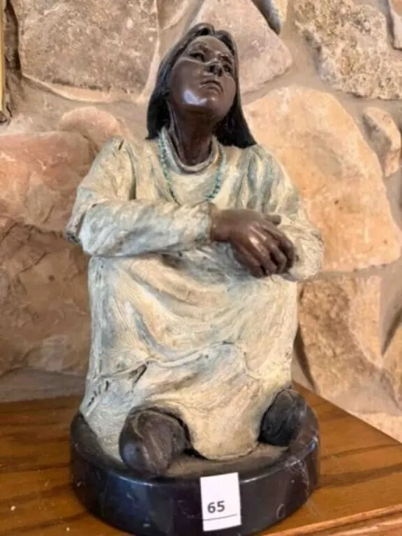 Bronze sculpure of Native Woman seated,