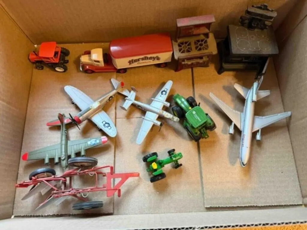 Box of misc. small airplane, tractors,