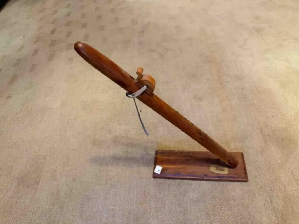 Wood peace pipe on wood stand