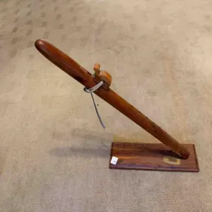Wood peace pipe on wood stand