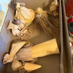 box of paper figurines