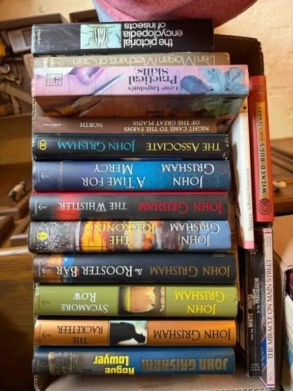 box of John Grisham and other books