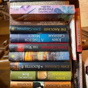 box of John Grisham and other books