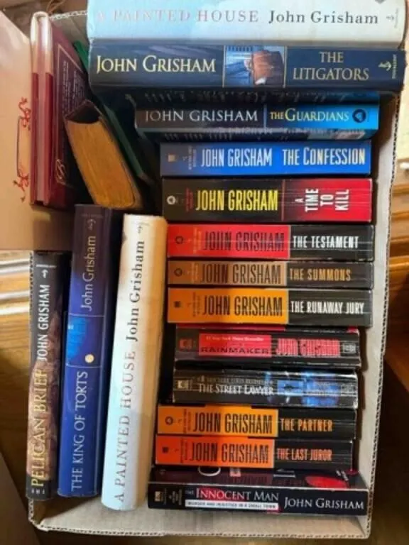 box of John Grisham and other books