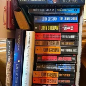 box of John Grisham and other books