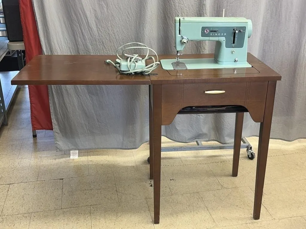 Vintage Turquoise Singer sewing machine In Table