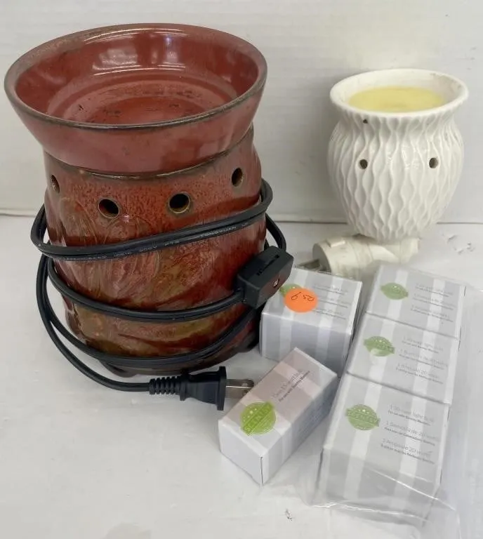 Two Scentsy burners with five extra bulbs.