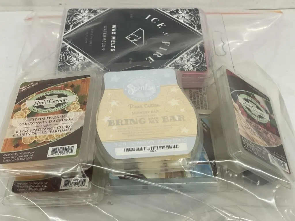 Bag of seven partially used Scentsy and other