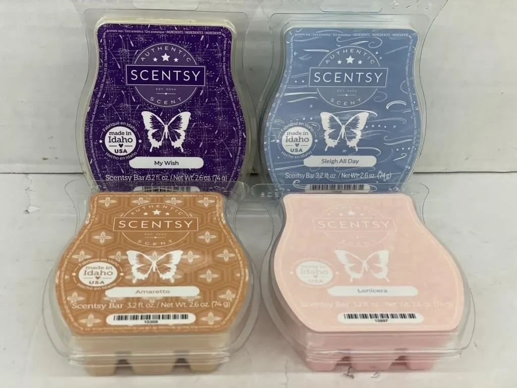 Four unopened Scentsy Bars. Variety of scents.