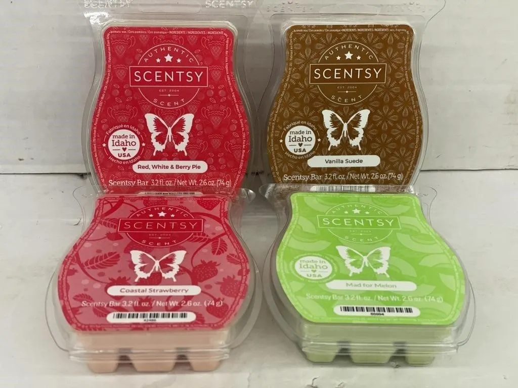 Four unopened Scentsy Bars. Variety of scents.
