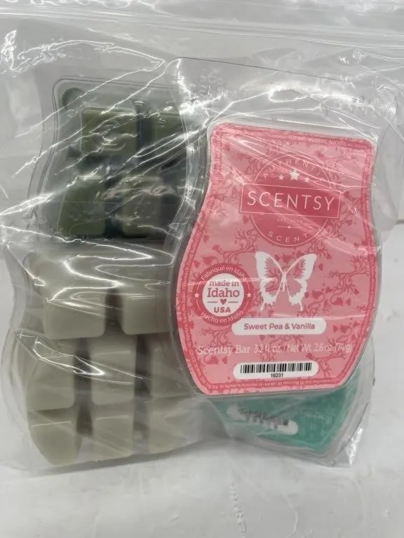 Four unopened Scentsy Bars. Variety of scents.