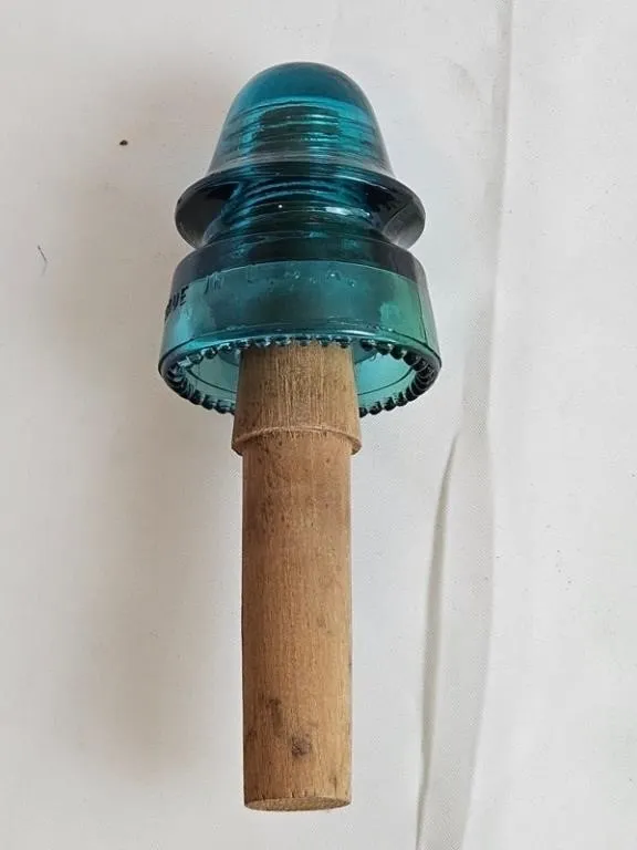 Vintage Turquoise Glass Insulator on Wood