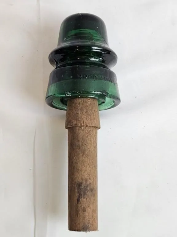 Brookfield Green Glass Insulator on Wood