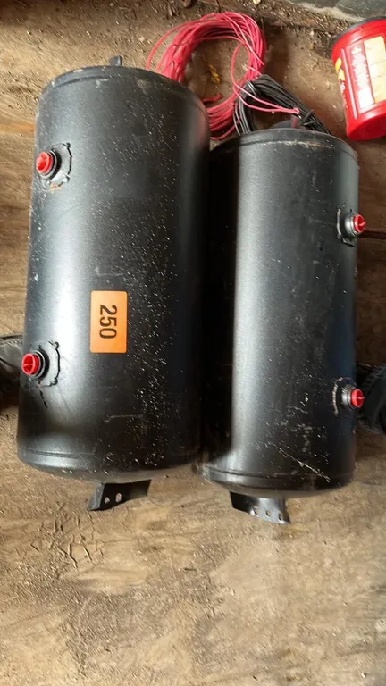 OFFSITE - 2 trailer air tanks, tank measures 24”x12”, mounting is wider.