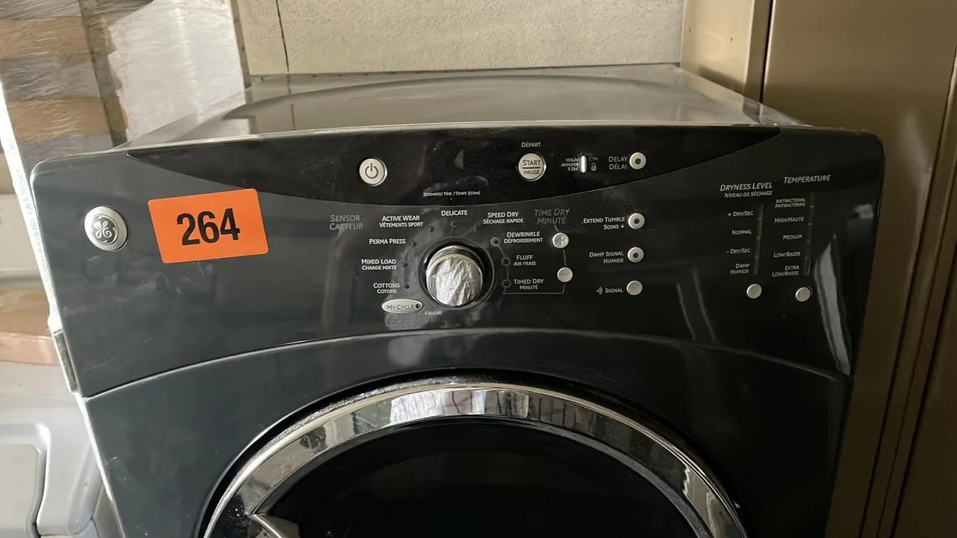 OFFSITE - GE Dryer with pedestal in great working condition. 27” wide. grey in colour.
