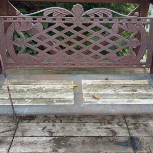 Cast Iron Outdoor Bench with Three Hanging Pot Holders and Decorative Garden Trellis