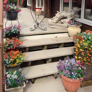 Outdoor Garden Decor with Faux Flowers, Planters, Driftwood Fountains, and Woodpecker Pull Toy