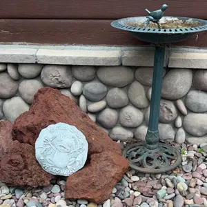 Metal Birdbath with Lava Rock Stones and Decorative Plaque