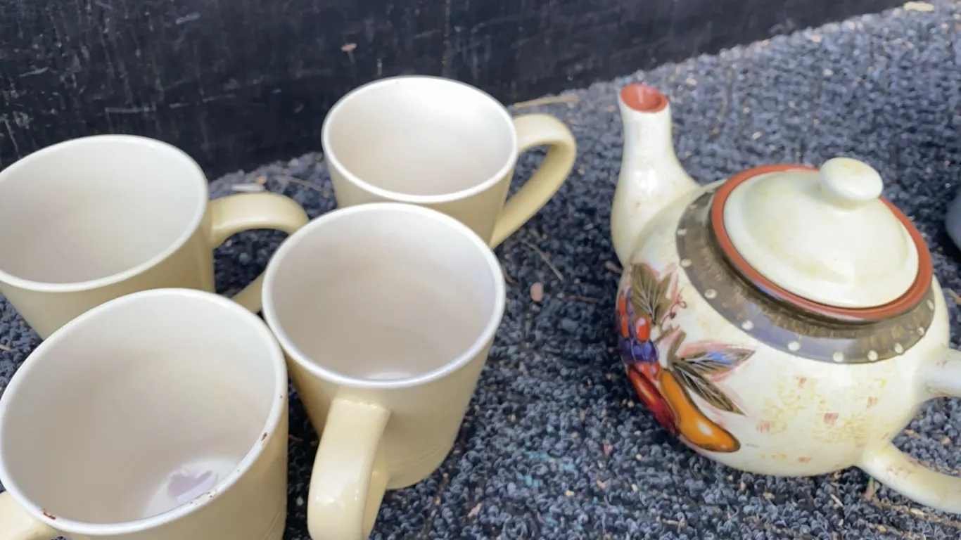 Ceramic Teapot with Fruit Motif and Four Beige Mugs